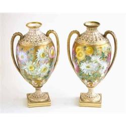 A pair of Copeland bone china 2-handled vases, each painted with a variety of flowers against a g...