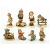 Image 1 : A group of eight Goebel figures, all of children with alpine costume in various activities...