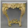 Image 1 : A mid 18th century giltwood console table, with later white marble top on a rococo base with scro...