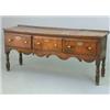 Image 1 : A mid 18th century oak dresser base, with three drawers fitted replaced brass handles, shaped apr...
