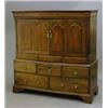 Image 1 : An 18th century oak cabinet, with two doors carved with arched panels over two short and three lo...