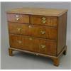Image 1 : An early 18th century walnut chest, of two short and two long drawers fitted brass loop handles o...