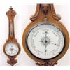 Image 1 : An Edwardian carved oak wheel barometer, with silvered thermometer and ceramic dial, signed C H B...
