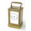Image 1 : A brass carriage clock, with enamelled dial, lever movement with compensated balance, striking on...