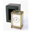 Image 1 : A brass carriage timepiece, with enamelled dial, in green leatherette case...