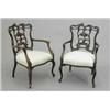 Image 1 : A pair of late 19th century mahogany elbow chairs, with pierced foliate carved splats and silk up...