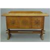 Image 1 : A Liberty & Co golden oak Arts & Crafts sideboard, with two cupboards and central panel carved wi...
