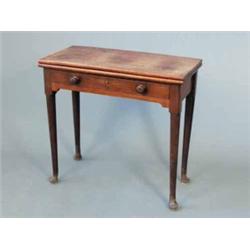 A George III mahogany folding tea table, with single drawer on tapered legs and pad feet 2ft 6ins...