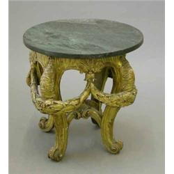 A 19th century giltwood urn stand, with later green marble circular top on four scroll legs ornat...