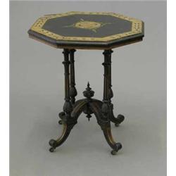 A Victorian ebonised occasional table, with octagonal ivory inlaid amboyna banded top on four ree...