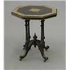 Image 1 : A Victorian ebonised occasional table, with octagonal ivory inlaid amboyna banded top on four ree...