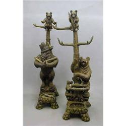 A 20th century Black Forest style carved wood bear hat stand, modelled as a tree with bear cub in...