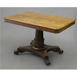 A late Regency breakfast table, with rectangular top on gun barrel stem and platform on four scro...