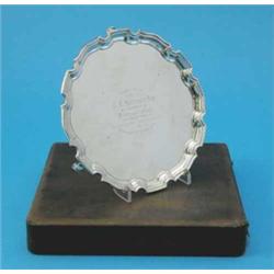 A cased George VI silver salver, with pie crust border on three scroll feet, Birmingham, 1948 11o...