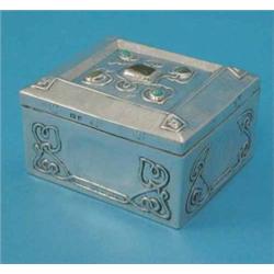 A Liberty & Co Cymric silver cigarette box, with hammered finish, the shaped lid set with five gr...