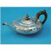 Image 1 : A George IV silver teapot, of squat circular form, decorated throughout with Rococo style cartouc...