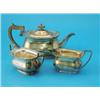 Image 1 : A George VI silver three piece tea set, of rounded rectangular form with shaped rims, maker C W F...