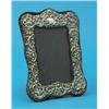 Image 1 : A silver mounted photograph frame, decorated throughout with 'C' scrolls and birds, London 1983 8...