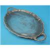 Image 1 : An Edwardian silver serving tray, of serpentine oval form with gadrooned rim and 'c' scroll handl...