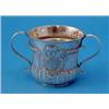 Image 1 : A George II silver porringer, with reeded twin scroll handles and decorated with an angel mask ca...