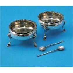 A pair of George III silver bun salts, with gadrooned rims, maker William Bateman but overstruck...