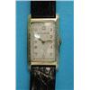 Image 1 : A gentleman's 14k gold Bulova wrist watch, with rectangular case and Arabic dial...