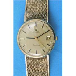 A gentleman's 9ct gold Omega wrist watch with gilt dial with baton numerals, centre seconds and d...