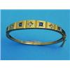 Image 1 : A Victorian 15ct bloomed gold hinged bangle, the graduated front gypsy-set with 4 sapphires and 3...