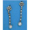 Image 1 : A pair of Edwardian diamond and pearl earrings, each millegrain-set with an articulated line of d...