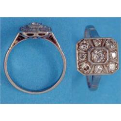 A 9-stone diamond octagonal shaped plaque ring, carre-set in white metal...