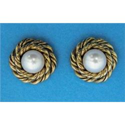 A pair of cultured pearl earrings, each with a single pearl in a double ropetwist gold border...