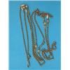 Image 1 : A 9ct gold guard chain, of fancy chased bead and snaffle links, 23.6grms...