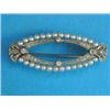 Image 1 : An Edwardian 18ct white gold and platinum brooch, of openwork oval shape, set pearls and diamonds...