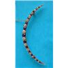 Image 1 : A late Victorian sapphire and diamond open crescent brooch, claw-set in gold with a graduated row...