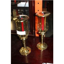TWO BRASS AND GLASS CANDLE HOLDERS