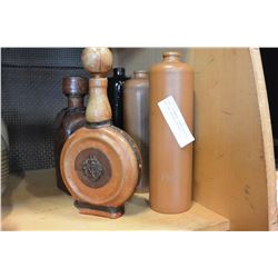 THREE STONEWARE LIQUOR BOTTLES AND TWO LEATHER BOTTLES