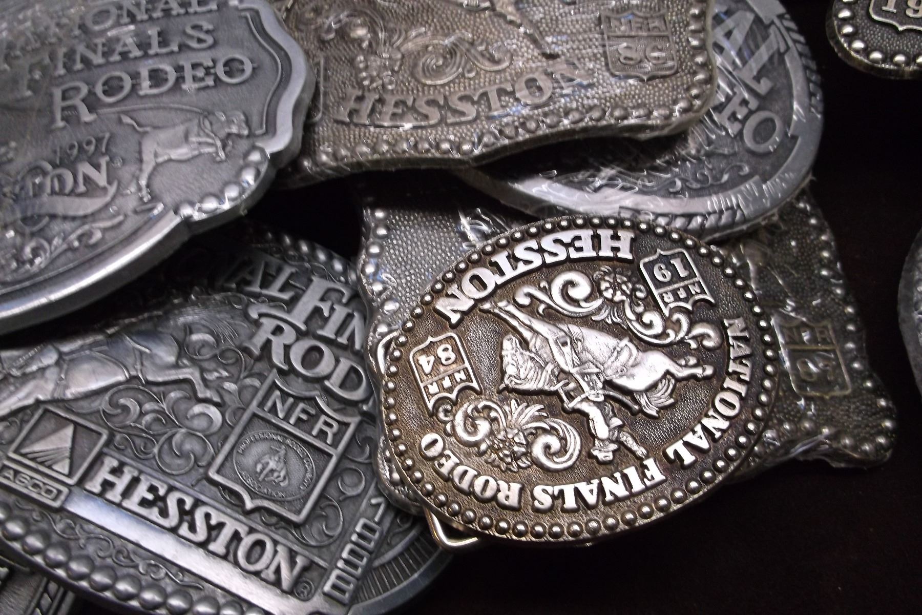 24 Hesston National Finals Rodeo Belt Buckles 1 Tie Tack 18942009