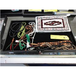 7 Sets of Prayer Beads and a Carpet Pouch