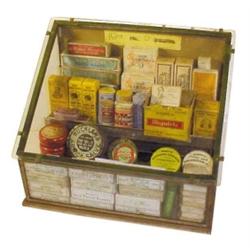 Glass countertop showcase full of med...