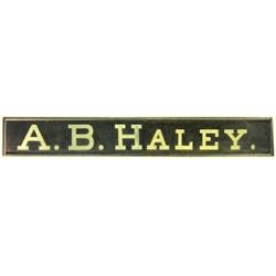 A.B. Haley wooden trade sign, hung in...