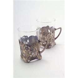 WÜRTTEMBERGISCHE METALLWARENFABRIK, Geislingen - Paar Teeglashalter, - Zinn, Glas. Durchbrochen...