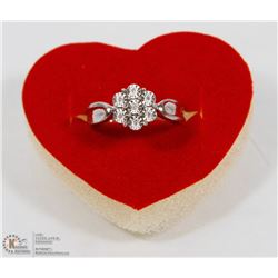 11) STERLING SILVER RING WITH 7 DIAMONDS
