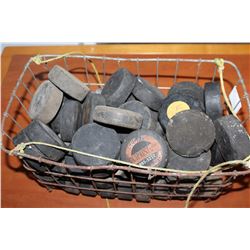 BASKET OF HOCKEY PUCKS