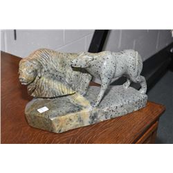 Hand carved soapstone of a pair of animals signed by artist Eric Lester, overall length 16"