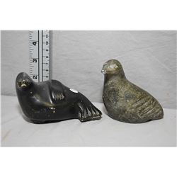 Two carved soapstone including a walrus 5  in length and a bird 3 1/2  in height