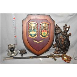 Selection of medieval themed wall mount collectibles including pair of swords, large wood and cast s