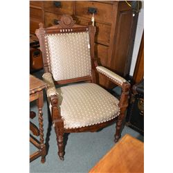 Antique open armed parlour chair with carved show wood, upholstered seat back and arm pads, with nai