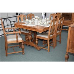 Nine piece walnut dining room suite including table with three insert leaves, six chairs including o