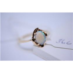 Ladies 10kt yellow gold ring set with oval cut opal gemstone