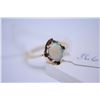 Image 1 : Ladies 10kt yellow gold ring set with oval cut opal gemstone